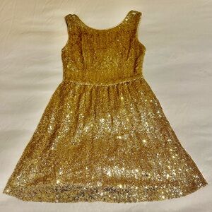 Selling this beautiful gold sequin dress. Only worn once.